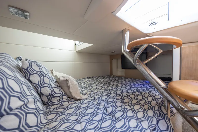  Yacht Photos Pics 2018 Formula 350 Crossover Bowrider OB cabin with patterned bedding and modern interior design.