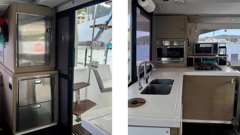  Yacht Photos Pics Modern kitchen interior of 2019 Fountaine Pajot Lucia 40 catamaran with stainless steel appliances.