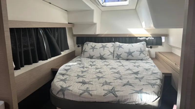  Yacht Photos Pics 2019 Fountaine Pajot Lucia 40 cabin with starfish-patterned bedding and skylight.