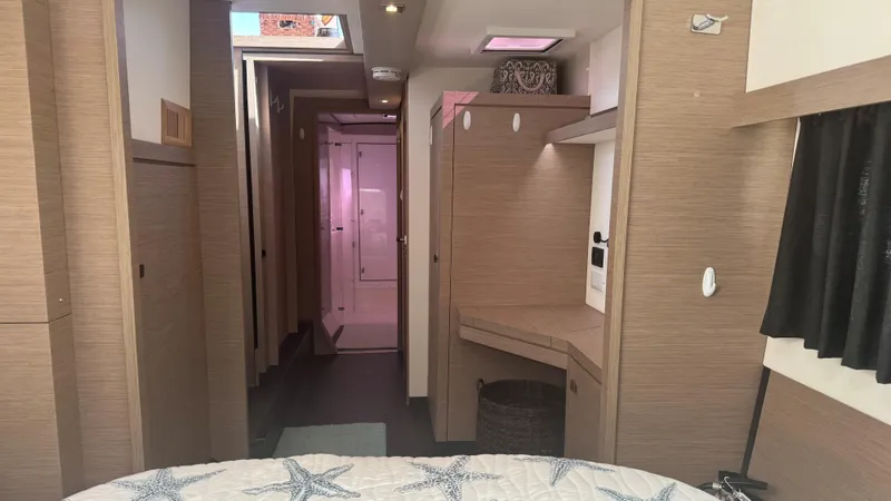  Yacht Photos Pics Interior of 2019 Fountaine Pajot Lucia 40 catamaran, featuring modern wood finishes and cozy design.