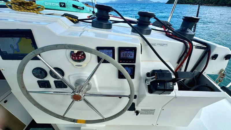  Yacht Photos Pics Helm of 2019 Fountaine Pajot Lucia 40 catamaran with navigation instruments and steering wheel.