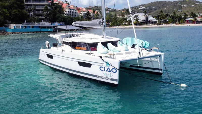  Yacht Photos Pics 2019 Fountaine Pajot Lucia 40 catamaran anchored in clear tropical waters.