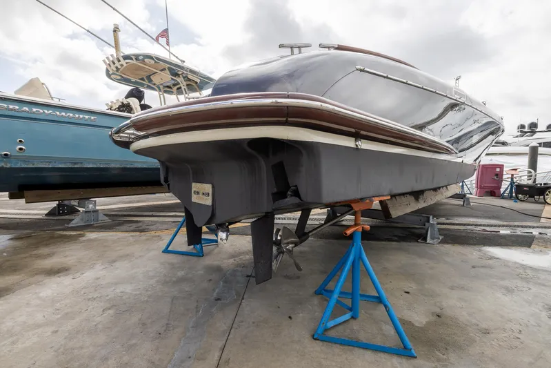  Yacht Photos Pics 2013 Riva Aquariva Super boat on stands at a marina.