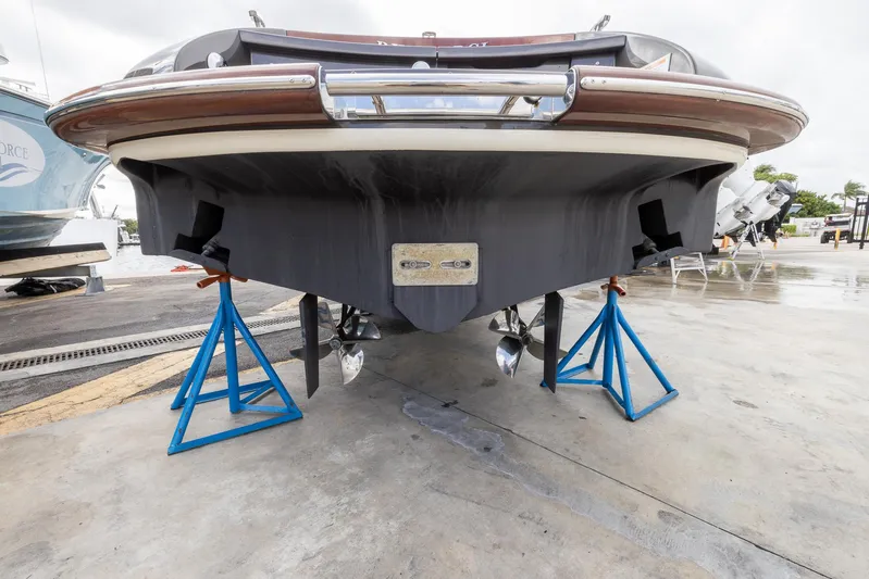  Yacht Photos Pics 2013 Riva Aquariva Super boat on stands, showcasing hull and propellers.