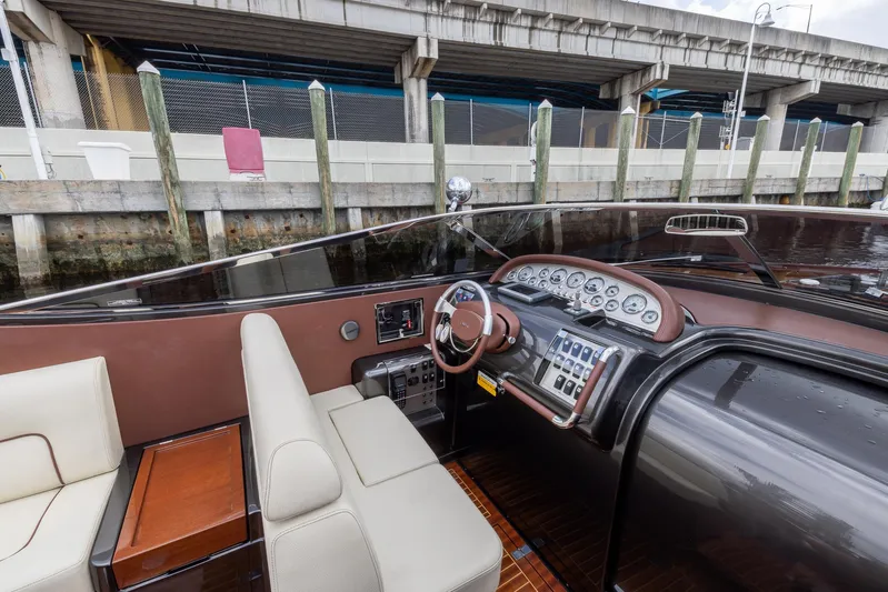  Yacht Photos Pics 2013 Riva Aquariva Super boat interior with luxurious dashboard and seating.