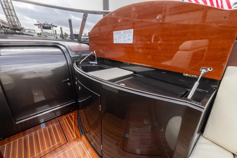  Yacht Photos Pics 2013 Riva Aquariva Super yacht interior with sleek wood finish and modern amenities.