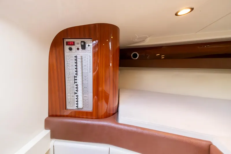  Yacht Photos Pics Interior of 2013 Riva Aquariva Super yacht with control panel and elegant wood finish.