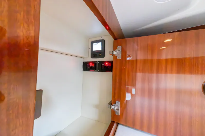  Yacht Photos Pics Interior cabin of 2013 Riva Aquariva Super with wooden finish and control panel.