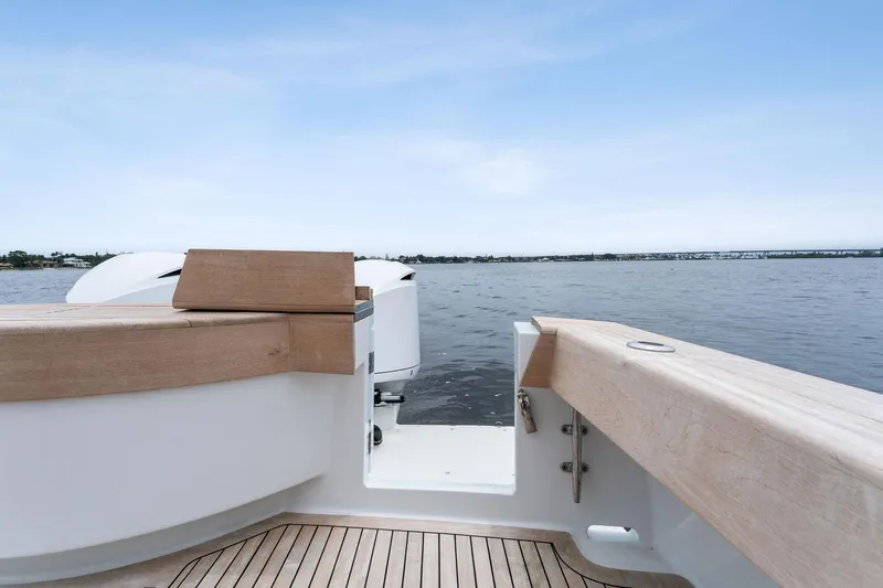 How Bout It Yacht Photos Pics 2017 Custom Carolina 43 Cinco Boatworks Express, rear deck view on calm water.