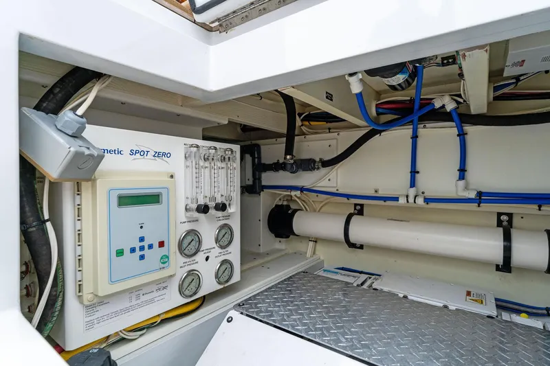 How Bout It Yacht Photos Pics Engine room of 2017 Custom Carolina 43 Cinco Boatworks Express, featuring control panel and piping.