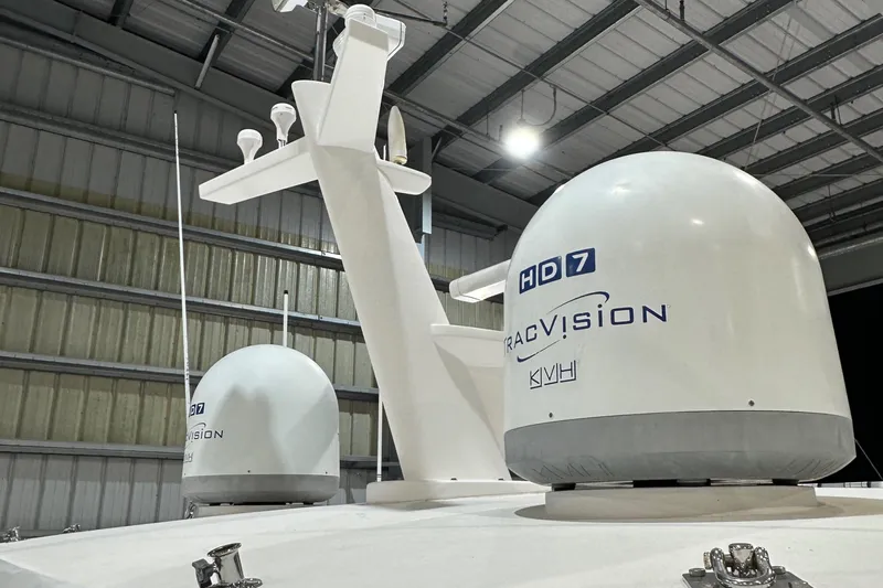  Yacht Photos Pics Satellite domes on Horizon PC60 yacht, 2017 model, in a warehouse setting.