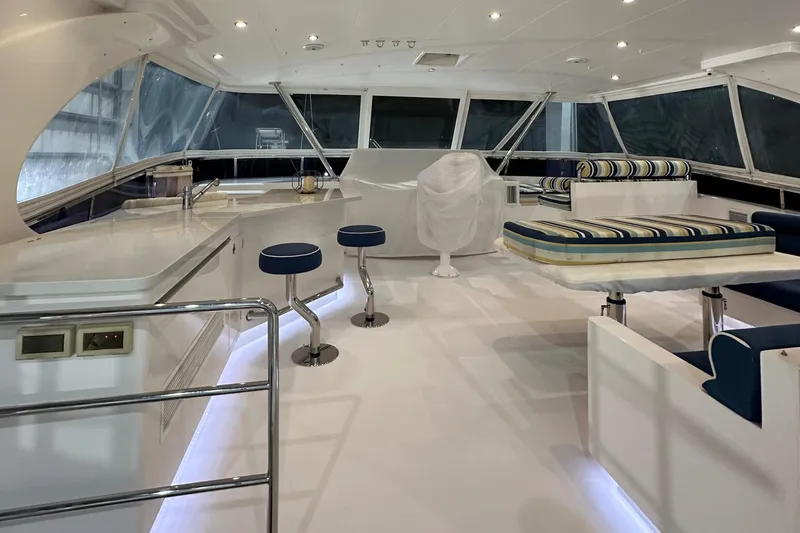  Yacht Photos Pics Luxurious interior of 2017 Horizon PC60 yacht with modern seating and bar stools.