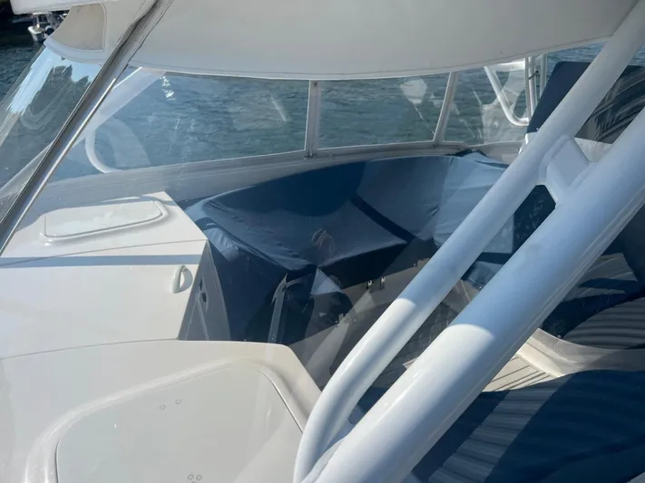  Yacht Photos Pics 2019 Intrepid 407 Cuddy boat interior with seating and clear windows.