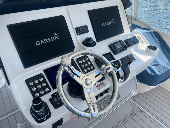  Yacht Photos Pics 2019 Intrepid 407 Cuddy helm with Garmin navigation system and modern controls.