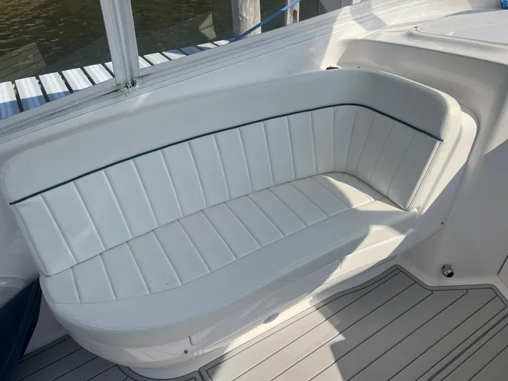  Yacht Photos Pics White cushioned seating on 2019 Intrepid 407 Cuddy boat.
