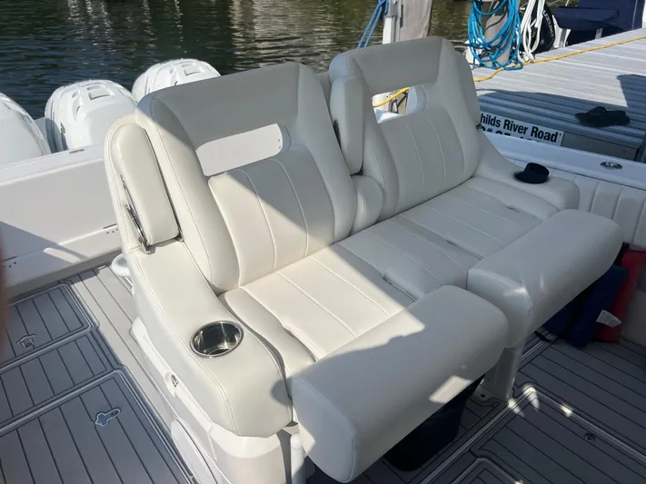  Yacht Photos Pics 2019 Intrepid 407 Cuddy boat with white leather seating and cup holders.