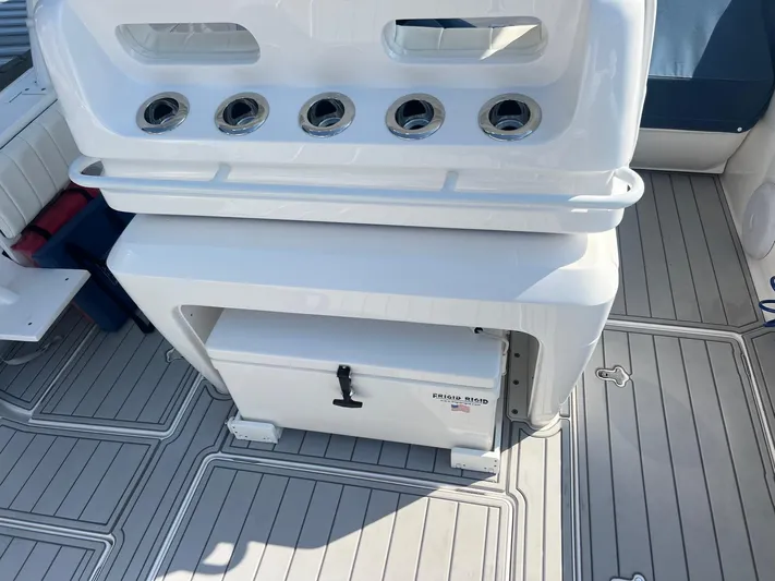  Yacht Photos Pics 2019 Intrepid 407 Cuddy boat deck with rod holders and storage compartment.