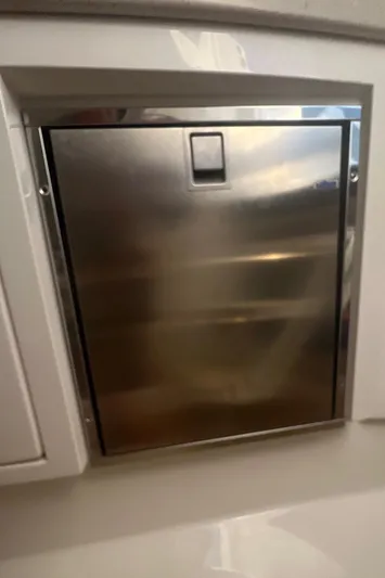  Yacht Photos Pics Stainless steel compartment door on a 2019 Intrepid 407 Cuddy boat.