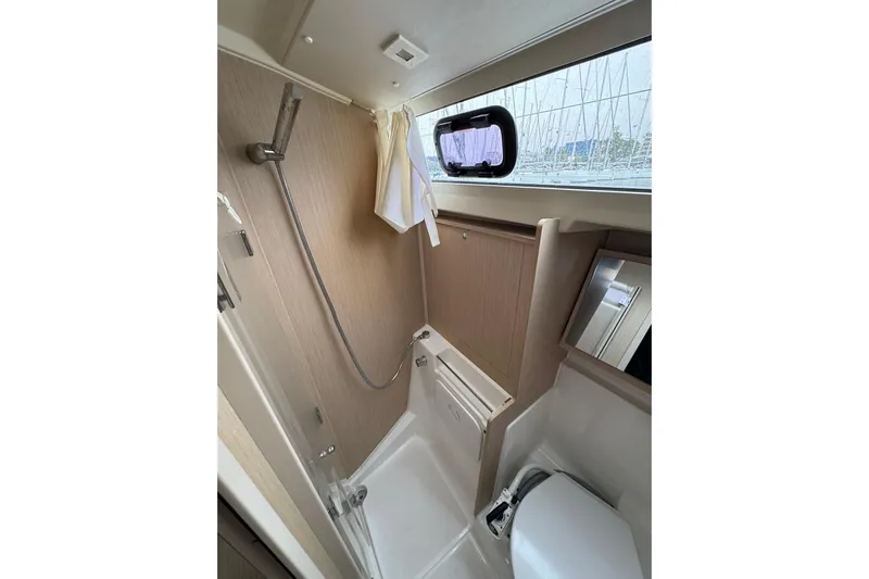 Nafsika Yacht Photos Pics Bathroom interior of 2020 Beneteau Oceanis 41.1 yacht, featuring shower and window.