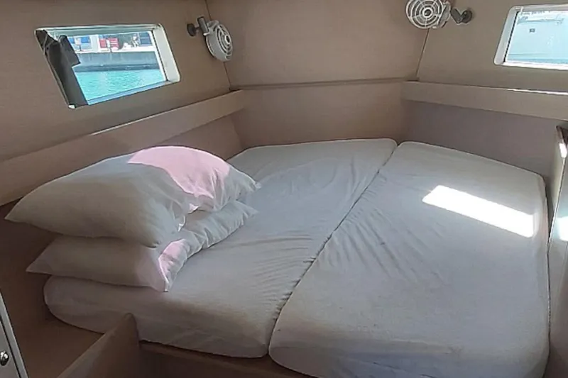 Nafsika Yacht Photos Pics Cozy cabin interior of 2020 Beneteau Oceanis 41.1 yacht with comfortable bedding.