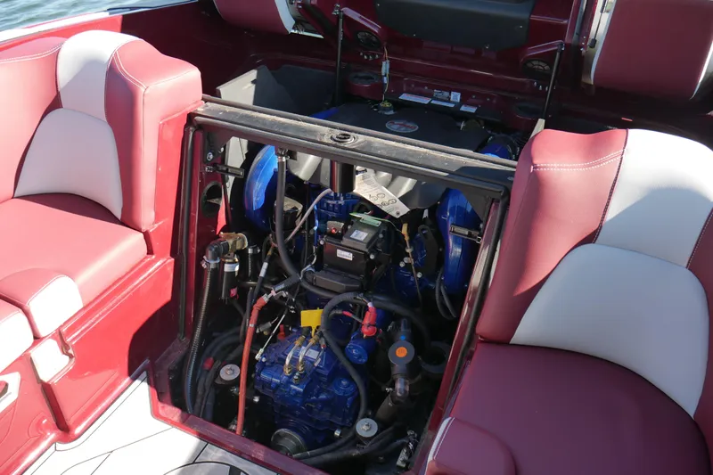  Yacht Photos Pics 2022 MasterCraft X22 boat engine compartment with red and white seating.
