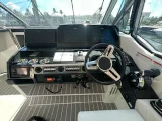 Happy2gether Yacht Photos Pics Cockpit of 2021 Formula 380 Super Sport Crossover OB with modern controls and steering wheel.