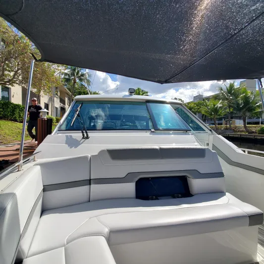 Happy2gether Yacht Photos Pics 2021 Formula 380 Super Sport Crossover OB boat with shaded seating area.