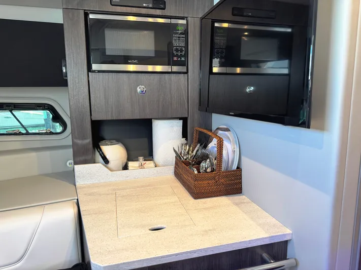 Happy2gether Yacht Photos Pics Interior of 2021 Formula 380 Super Sport Crossover OB with modern kitchen amenities.