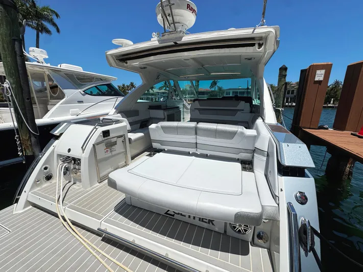 Happy2gether Yacht Photos Pics 2021 Formula 380 Super Sport Crossover OB yacht with spacious seating, docked under clear skies.