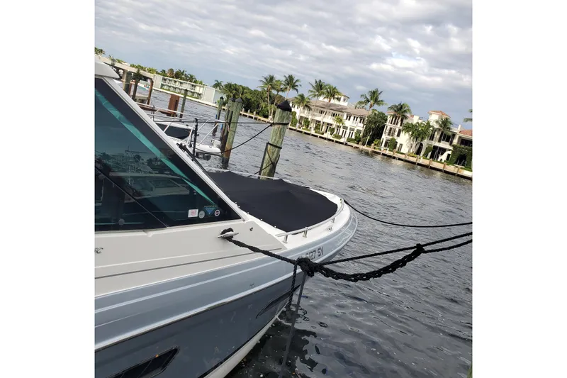 Happy2gether Yacht Photos Pics 2021 Formula 380 Super Sport Crossover OB docked by waterfront homes.