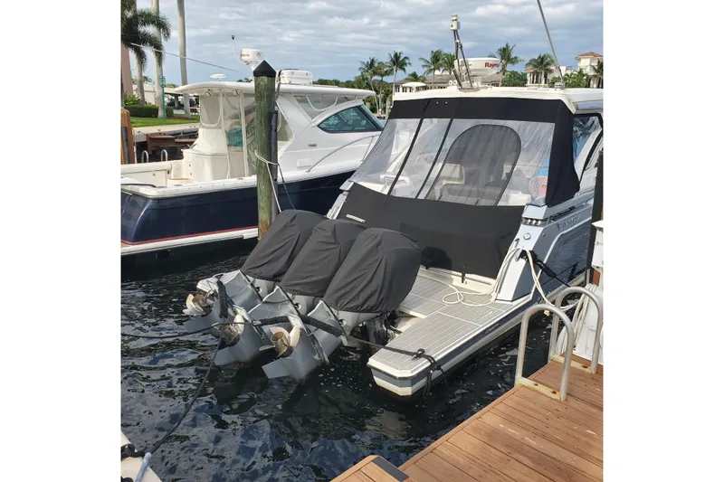 Happy2gether Yacht Photos Pics 2021 Formula 380 Super Sport Crossover OB docked with covered outboard motors.