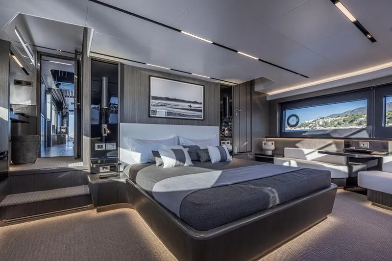 Pearly Spencer Yacht Photos Pics Luxurious bedroom interior of 2024 Pearl 82 yacht with modern design and scenic window view.