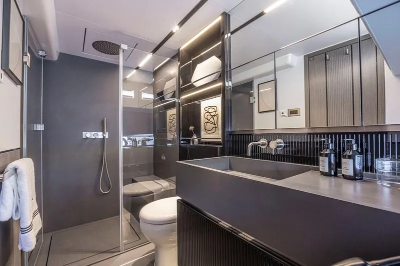 Pearly Spencer Yacht Photos Pics Modern bathroom in 2024 Pearl 82 yacht with sleek design and luxury fixtures.