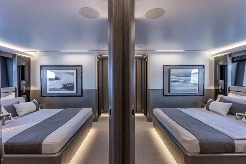 Pearly Spencer Yacht Photos Pics Luxurious 2024 Pearl 82 yacht interior with elegant twin bedrooms and modern decor.