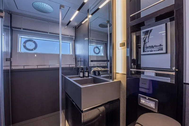 Pearly Spencer Yacht Photos Pics Luxurious bathroom interior in 2024 Pearl 82 yacht, featuring modern fixtures and elegant design.