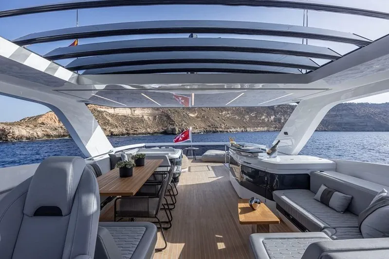 Pearly Spencer Yacht Photos Pics Luxurious 2024 Pearl 82 yacht interior with elegant seating, dining area, and ocean view.