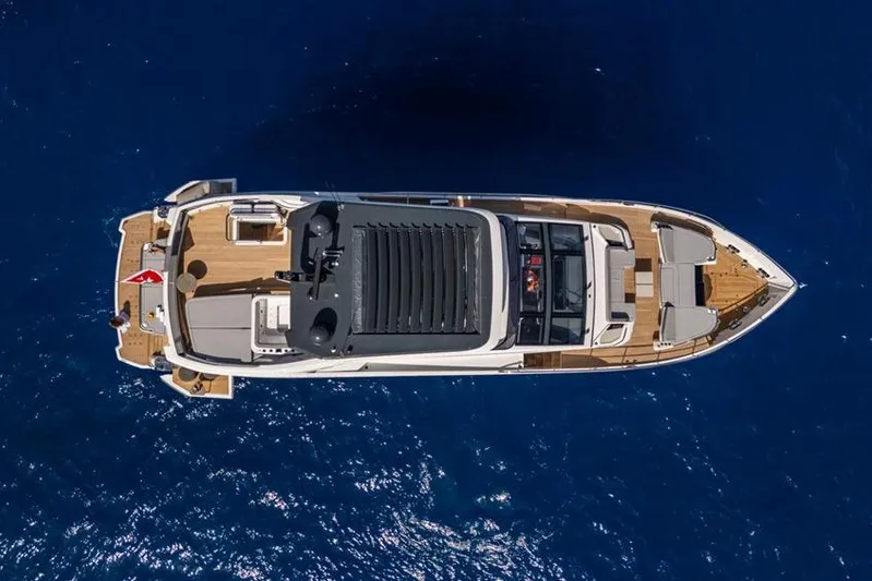 Pearly Spencer Yacht Photos Pics Aerial view of 2024 Pearl 82 yacht on deep blue ocean waters.