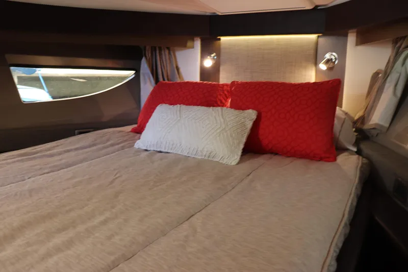 La Bella Vita Yacht Photos Pics Luxurious cabin interior of 2016 Sea Ray 400 Sundancer with cozy bedding.