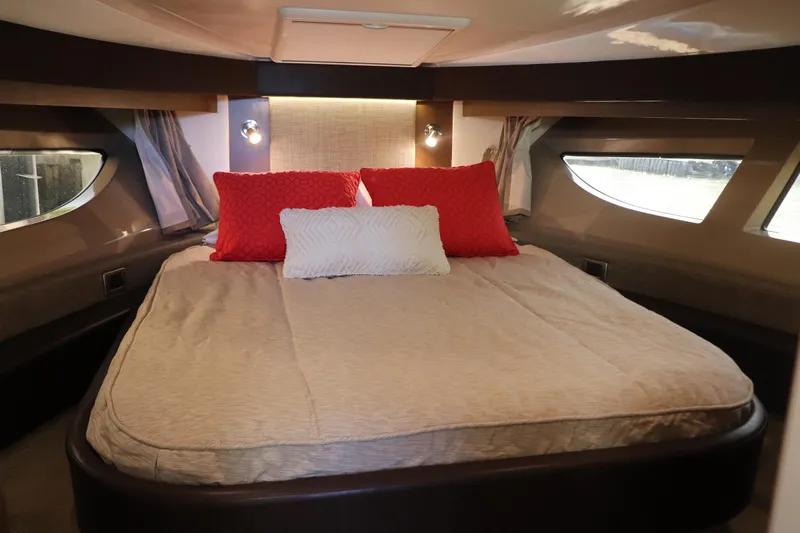 La Bella Vita Yacht Photos Pics Luxurious bedroom interior of 2016 Sea Ray 400 Sundancer yacht with elegant bedding.
