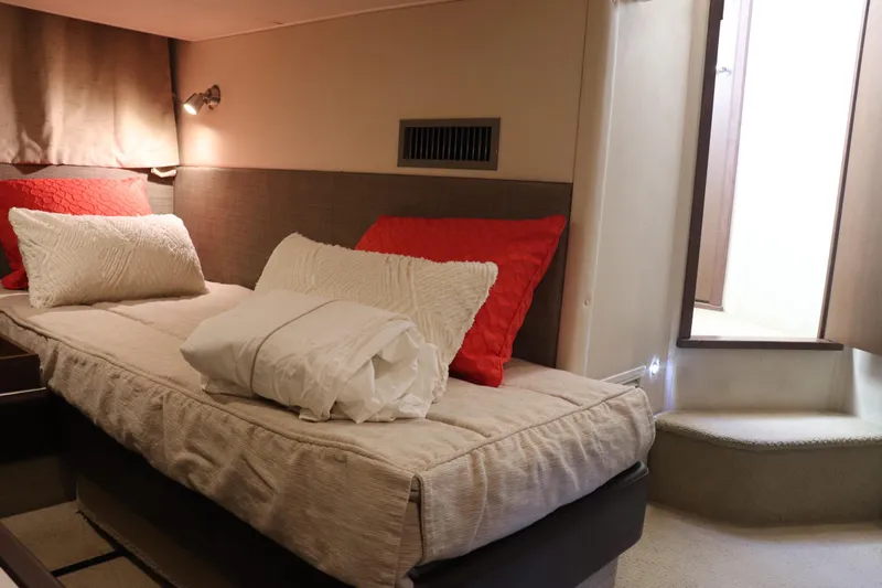 La Bella Vita Yacht Photos Pics Interior cabin of 2016 Sea Ray 400 Sundancer with cozy bedding and modern design.