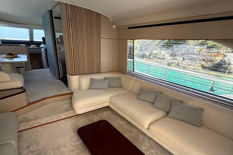  Yacht Photos Pics Luxurious interior of 2022 Azimut Fly 68 yacht with elegant seating and scenic window view.