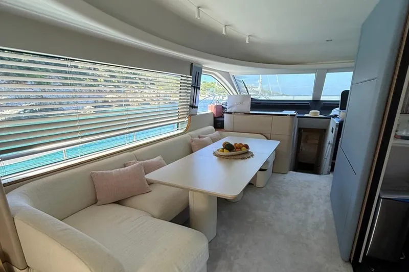  Yacht Photos Pics Luxurious interior of 2022 Azimut Fly 68 yacht with elegant seating and dining area.
