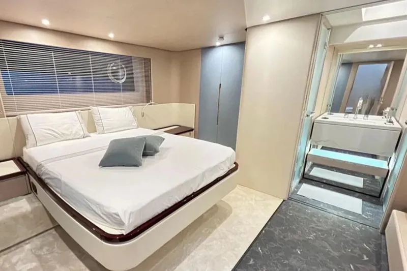  Yacht Photos Pics Luxurious bedroom interior of 2022 Azimut Fly 68 yacht with modern design and ensuite bathroom.