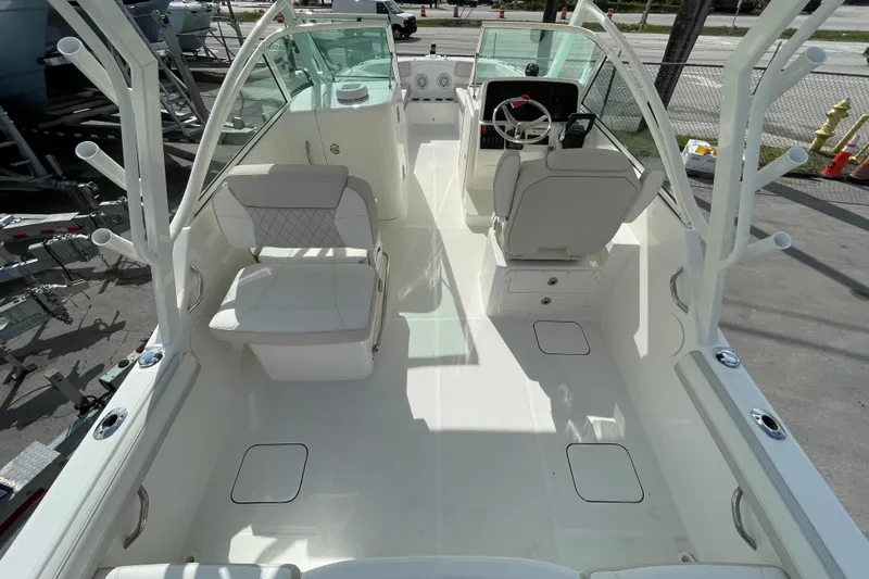 55889 230dc Sf Yacht Photos Pics 2025 World Cat 230 DC boat interior with seating and steering console.