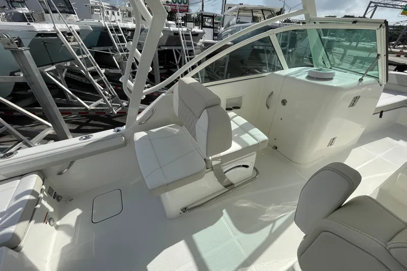 55889 230dc Sf Yacht Photos Pics 2025 World Cat 230 DC boat interior with white seating and modern design.