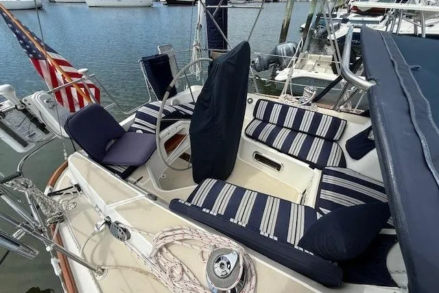 Star Yacht Photos Pics Cockpit of 1998 Sabre 402 sailboat with striped cushions and American flag.
