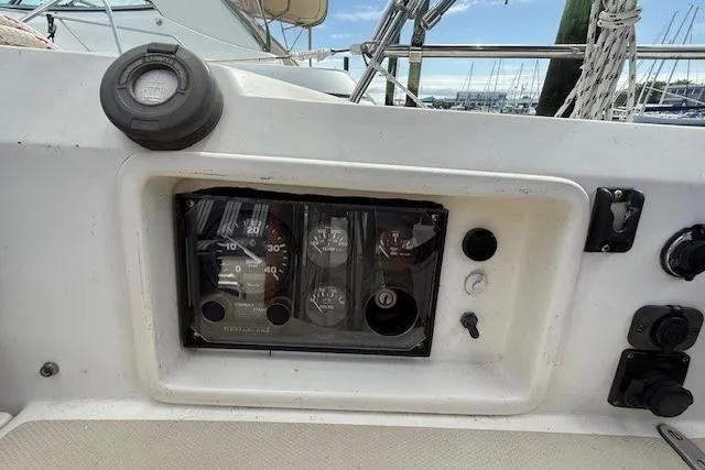 Star Yacht Photos Pics Control panel of a 1998 Sabre 402 sailboat, featuring gauges and switches.