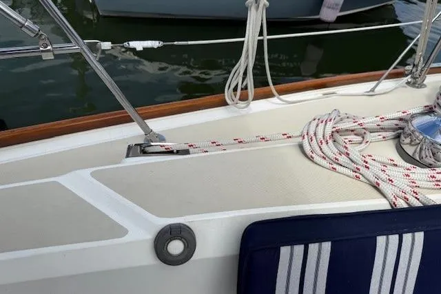 Star Yacht Photos Pics Deck of 1998 Sabre 402 sailboat with ropes and striped cushion.