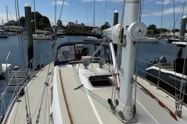 Star Yacht Photos Pics 1998 Sabre 402 sailboat docked in marina, showcasing deck and rigging.