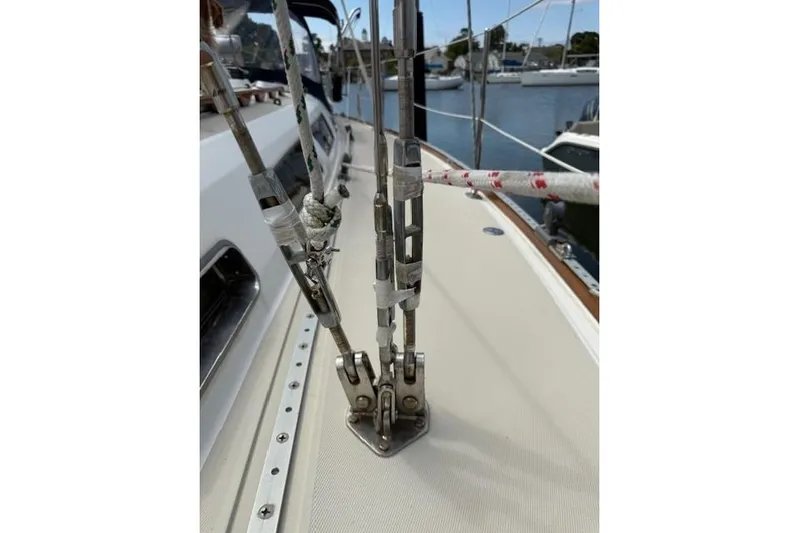 Star Yacht Photos Pics Close-up of rigging on a 1998 Sabre 402 sailboat deck, docked in a marina.